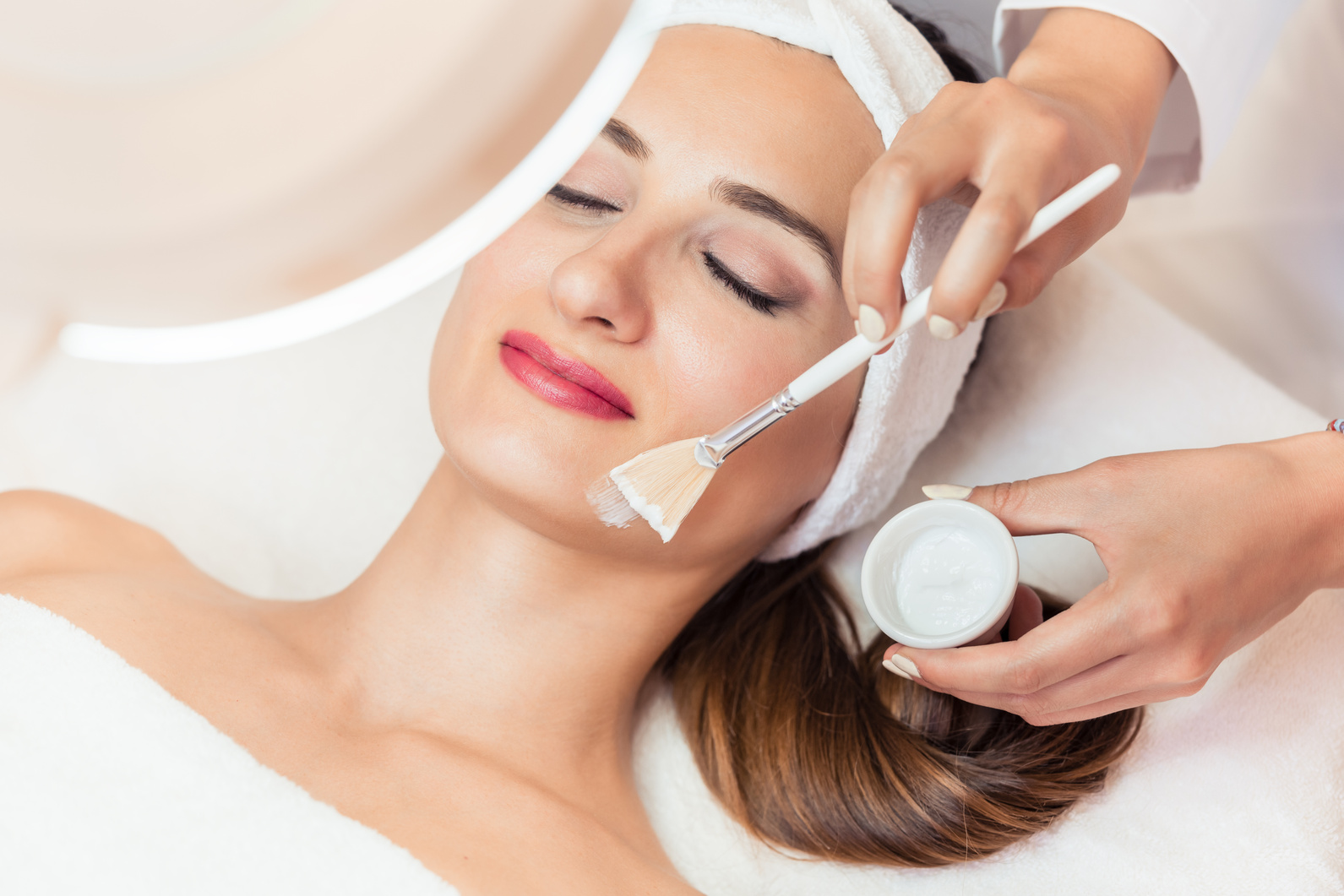 Woman Relaxing during Facial Treatment