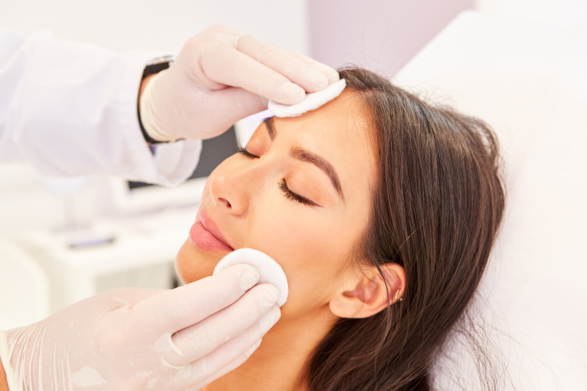 Young Woman Having Professional Facial Cleansing